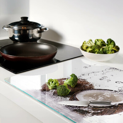 Tagliere in vetro temperato con motivo cocco immerso nell'acqua