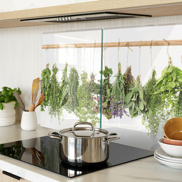 Tagliere in vetro temperato con stampa di erbe essiccate su sfondo a spago