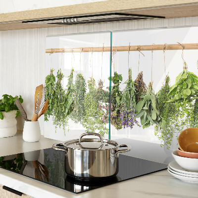 Tagliere in vetro temperato con stampa di erbe essiccate su sfondo a spago