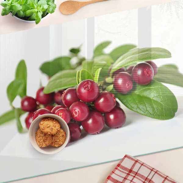 Tagliere in vetro con motivo di mirtilli rossi e foglie