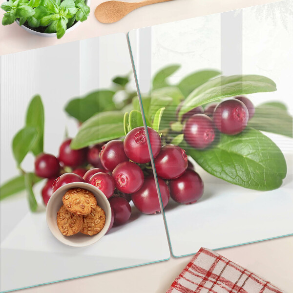 Tagliere in vetro con motivo di mirtilli rossi e foglie