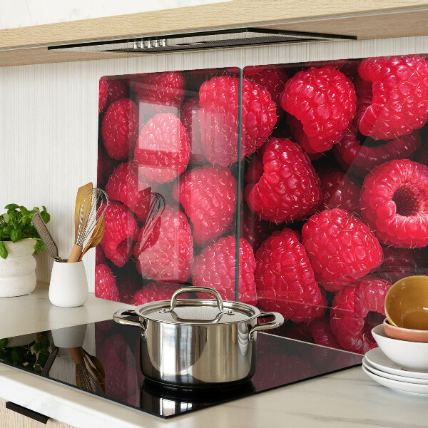 Tagliere in vetro temperato con stampa di lamponi sullo sfondo