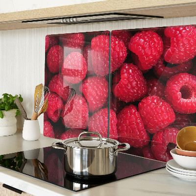 Tagliere in vetro temperato con stampa di lamponi sullo sfondo