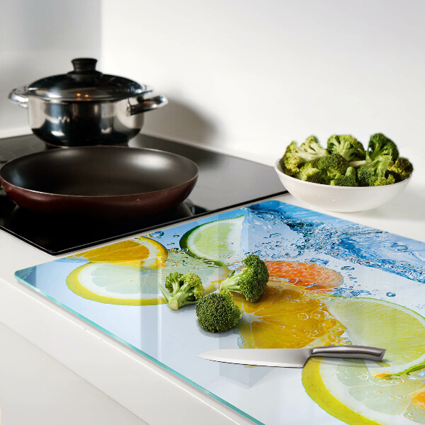 Tagliere in vetro con motivo agrumi immersi in acqua