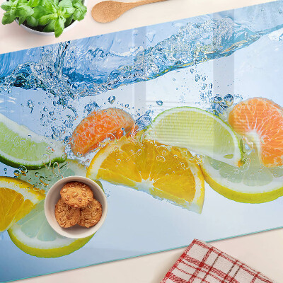 Tagliere in vetro con motivo agrumi immersi in acqua