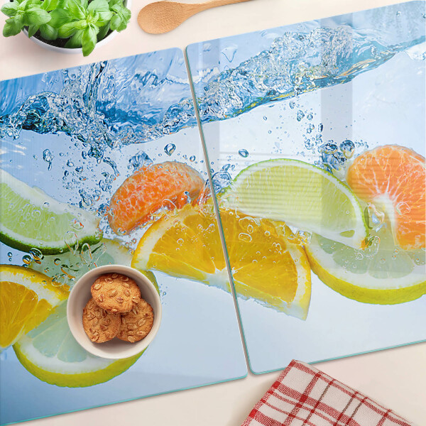 Tagliere in vetro con motivo agrumi immersi in acqua