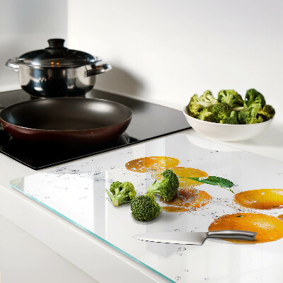 Tagliere in vetro temperato con motivo agrumi immersi in acqua