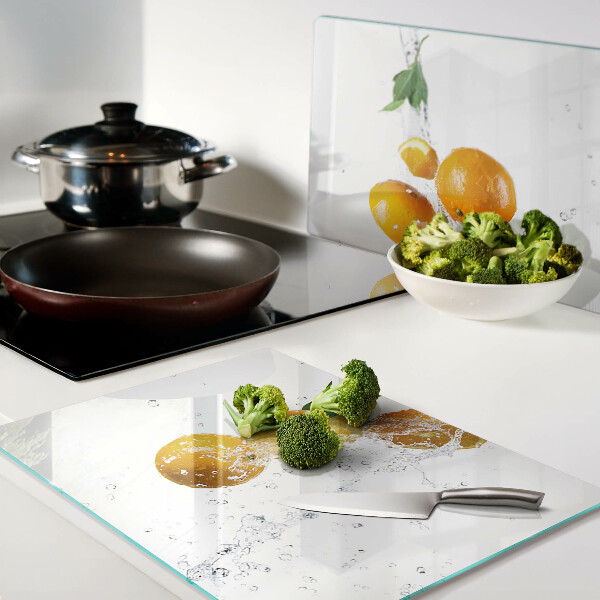 Tagliere in vetro temperato con motivo agrumi immersi in acqua