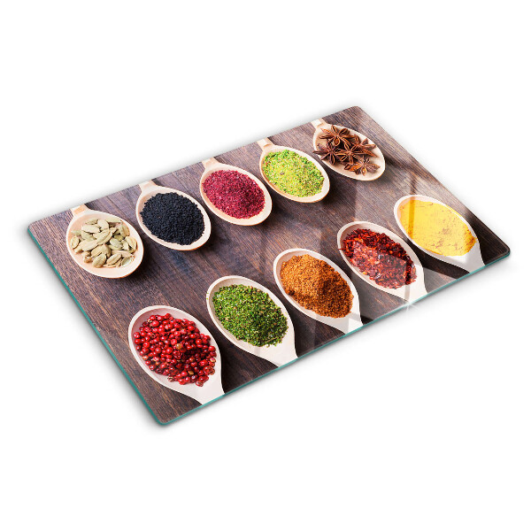 Tagliere in vetro con motivo di spezie nei cucchiai