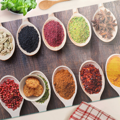 Tagliere in vetro con motivo di spezie nei cucchiai