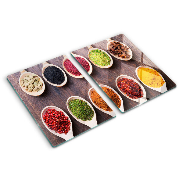 Tagliere in vetro con motivo di spezie nei cucchiai