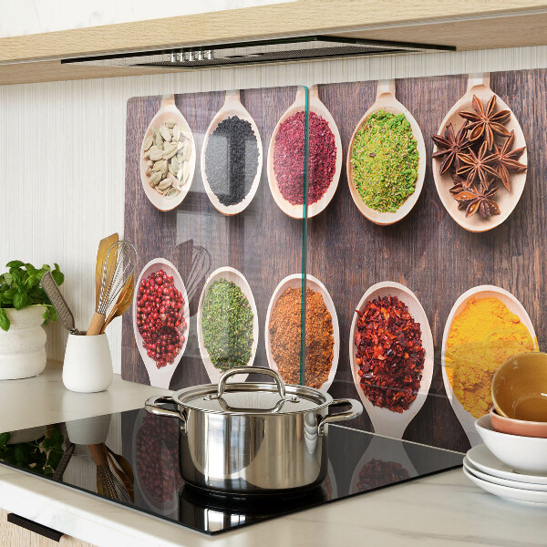 Tagliere in vetro con motivo di spezie nei cucchiai