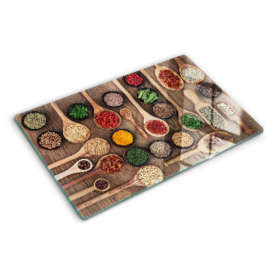 Tagliere in vetro temperato con motivo di spezie ed erbe rappresentate su cucchiai