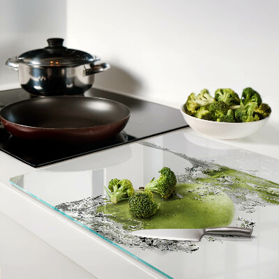 Tagliere in vetro temperato con stampa di una mela verde immersa in acqua