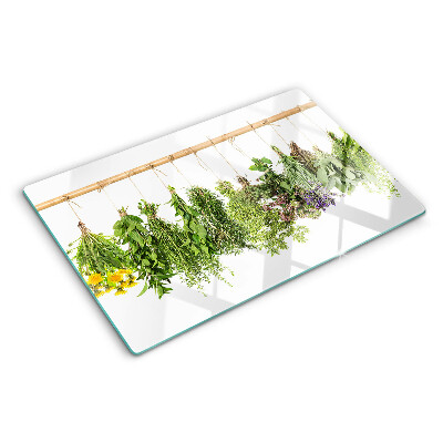 Tagliere in vetro temperato con stampa di erbe essiccate su sfondo a spago