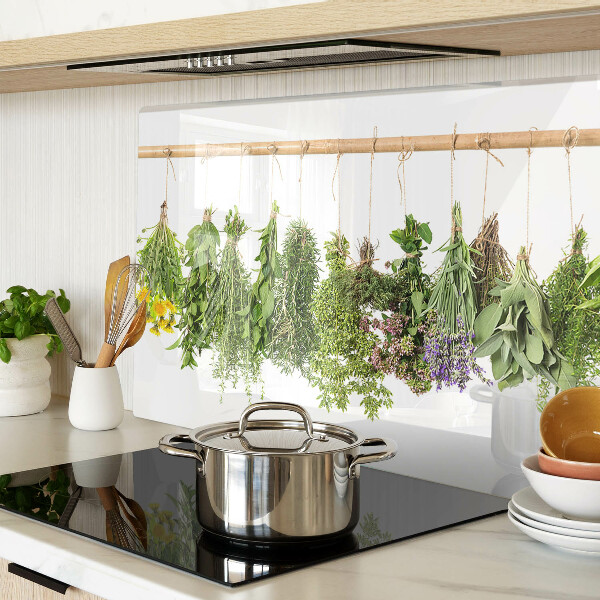 Tagliere in vetro temperato con stampa di erbe essiccate su sfondo a spago