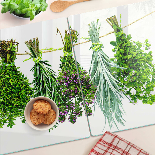 Tagliere in vetro temperato con stampa di erbe essiccate legate con spago