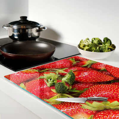 Tagliere in vetro temperato con motivo di fragole sullo sfondo