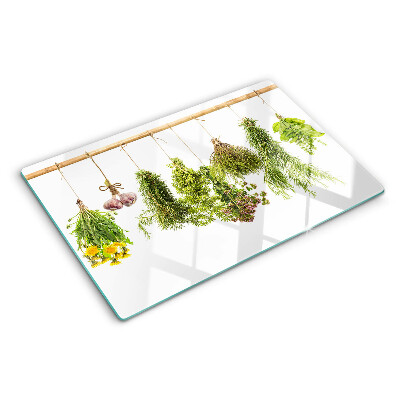 Tagliere in vetro temperato con decorazione di erbe disposte a mazzetti appesi
