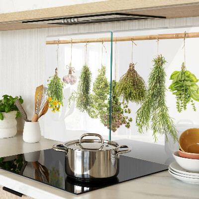 Tagliere in vetro temperato con decorazione di erbe disposte a mazzetti appesi