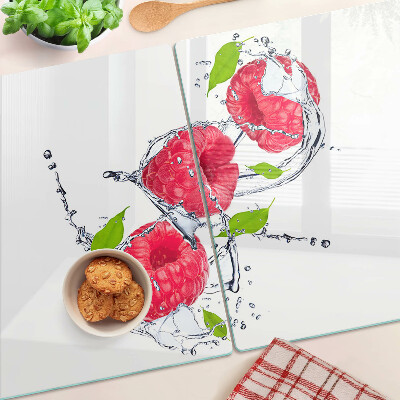 Tagliere in vetro temperato con stampa di lamponi in acqua e foglie