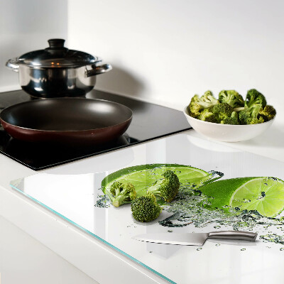 Tagliere in vetro con stampa di limoni immersi in acqua con bollicine