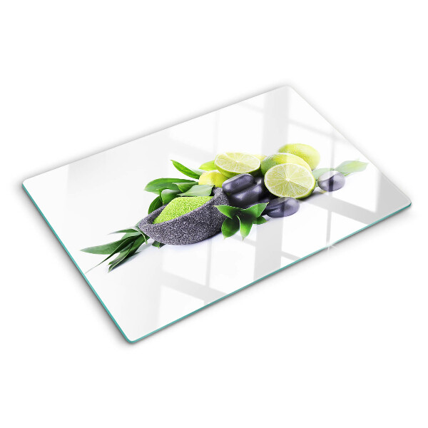 Tagliere in vetro Limoni e uva su sfondo verde