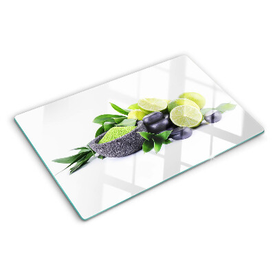 Tagliere in vetro Limoni e uva su sfondo verde