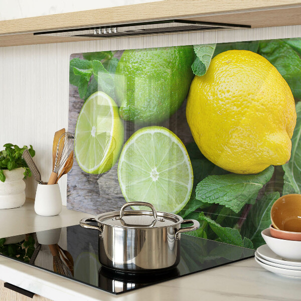 Tagliere in vetro temperato con decorazione di limoni e lime e foglie di menta