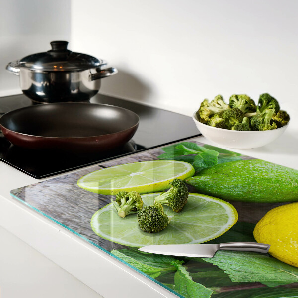 Tagliere in vetro temperato con decorazione di limoni e lime e foglie di menta