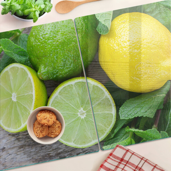 Tagliere in vetro temperato con decorazione di limoni e lime e foglie di menta