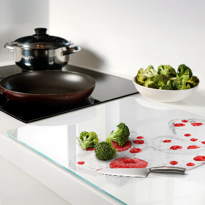 Tagliere in vetro temperato con stampa raffigurante bollicine di lampone in acqua