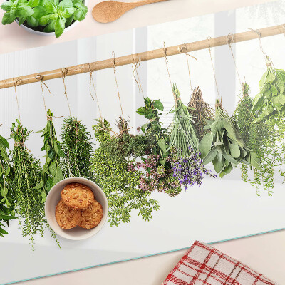 Tagliere in vetro temperato con stampa di erbe essiccate su sfondo a spago