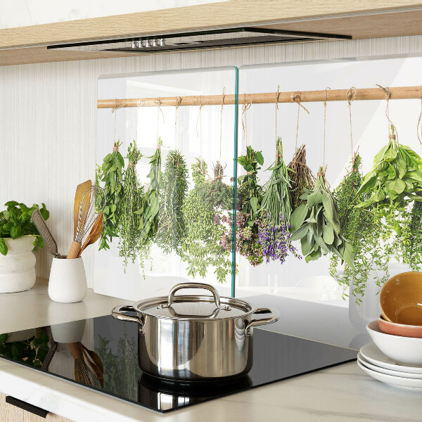 Tagliere in vetro temperato con stampa di erbe essiccate su sfondo a spago