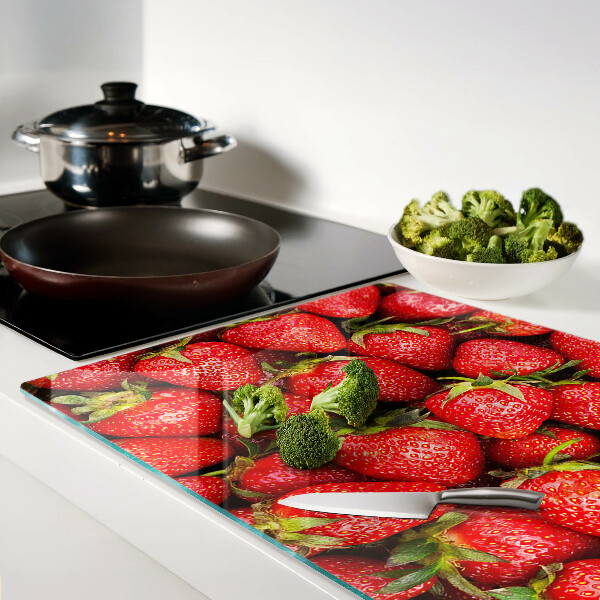 Tagliere in vetro temperato con stampa di fragole su sfondo rosso