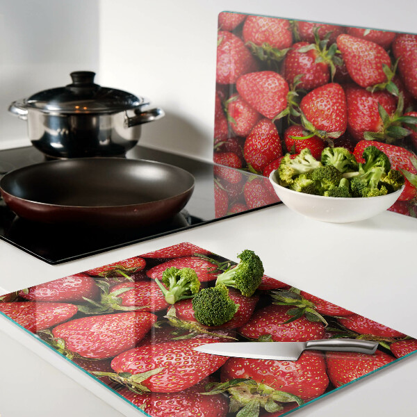Tagliere in vetro temperato con stampa di fragole su sfondo rosso