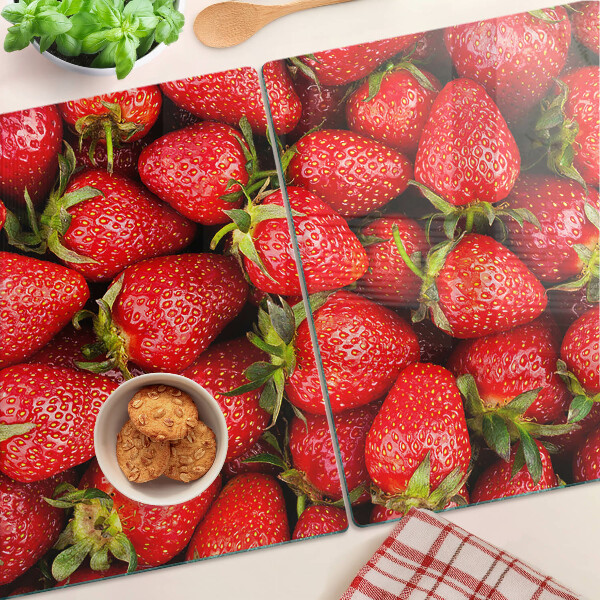 Tagliere in vetro temperato con stampa di fragole su sfondo rosso