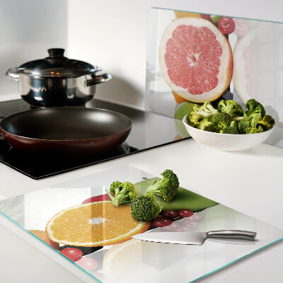 Tagliere in vetro con motivo di frutti agrumati nei toni pastello