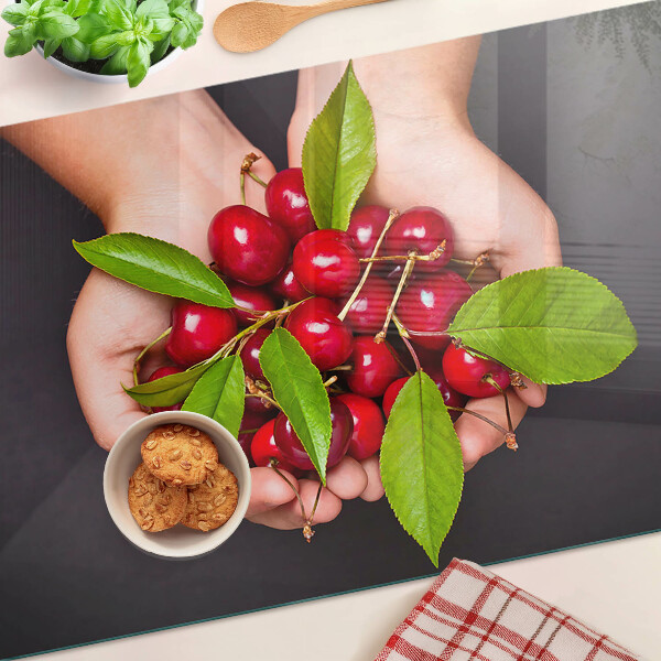 Tagliere in vetro temperato con stampa di ciliegie rosse che si incontrano nelle mani