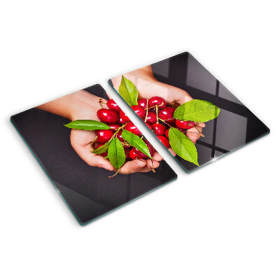 Tagliere in vetro temperato con stampa di ciliegie rosse che si incontrano nelle mani