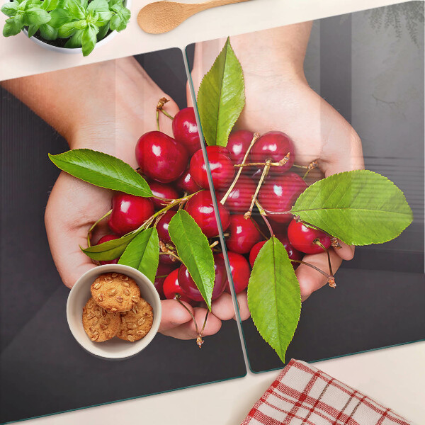 Tagliere in vetro temperato con stampa di ciliegie rosse che si incontrano nelle mani