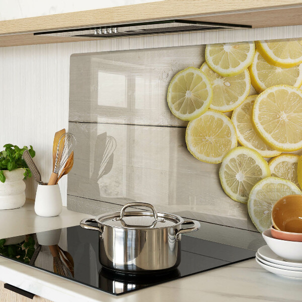 Tagliere in vetro temperato con stampa decorativa a fette di limone su sfondo di legno