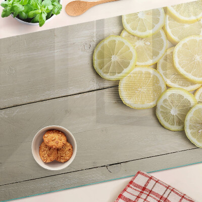 Tagliere in vetro temperato con stampa decorativa a fette di limone su sfondo di legno