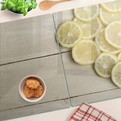 Tagliere in vetro temperato con stampa decorativa a fette di limone su sfondo di legno