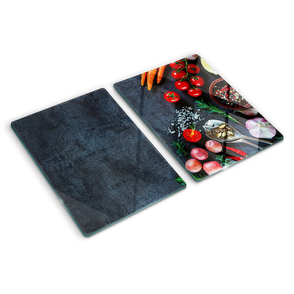 Tagliere in vetro temperato con stampa di verdure e spezie su sfondo scuro