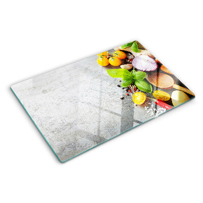 Tagliere in vetro con stampa degli ingredienti da cucina e delle erbe
