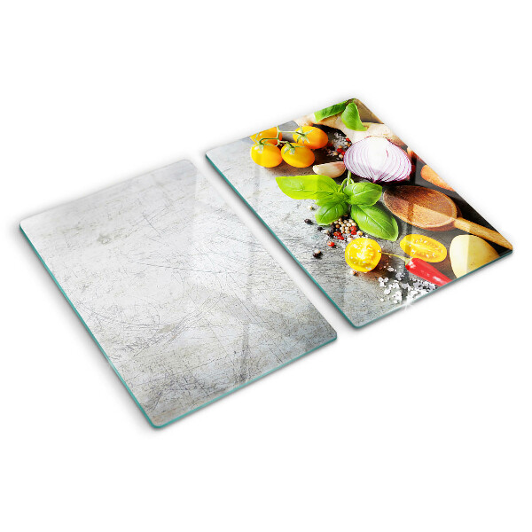 Tagliere in vetro con stampa degli ingredienti da cucina e delle erbe