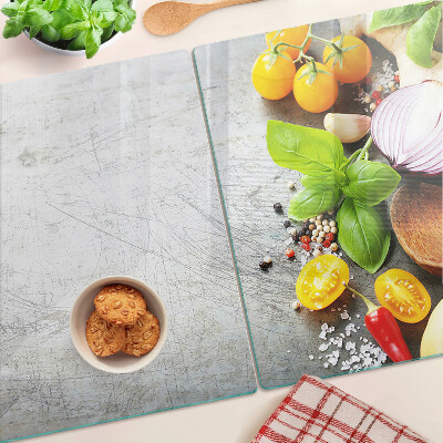 Tagliere in vetro con stampa degli ingredienti da cucina e delle erbe