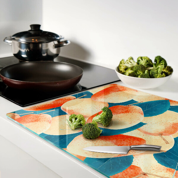 Tagliere in vetro temperato con decoro di pesche su sfondo di foglie