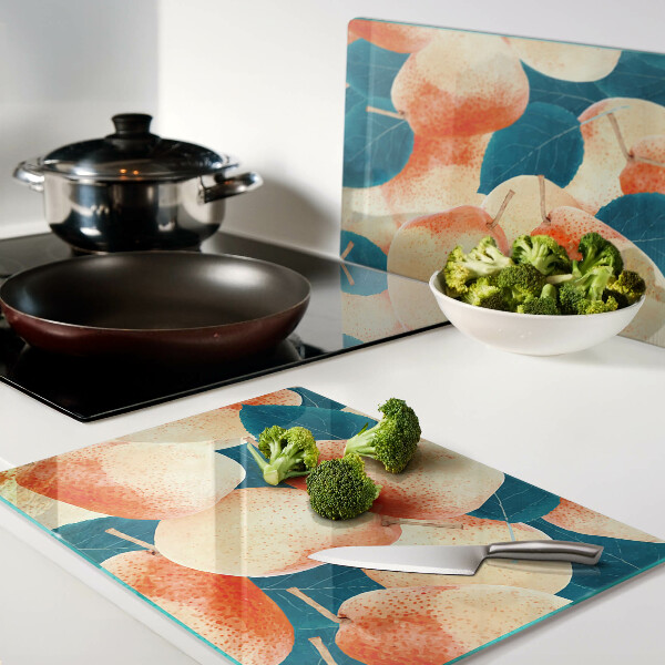 Tagliere in vetro temperato con decoro di pesche su sfondo di foglie